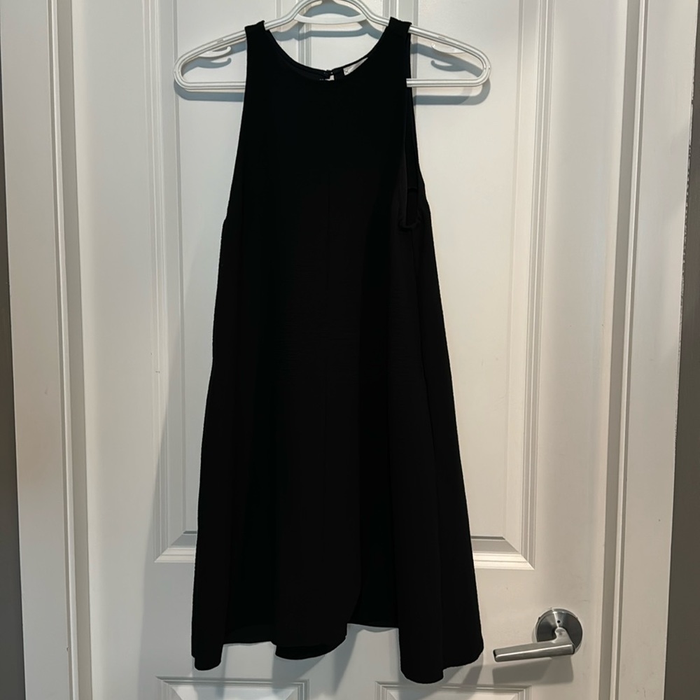 Mini black dress with pockets. Flowy